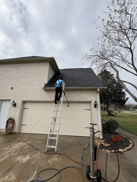 Gleam Clean technician checking roof access before exterior glass cleaning
