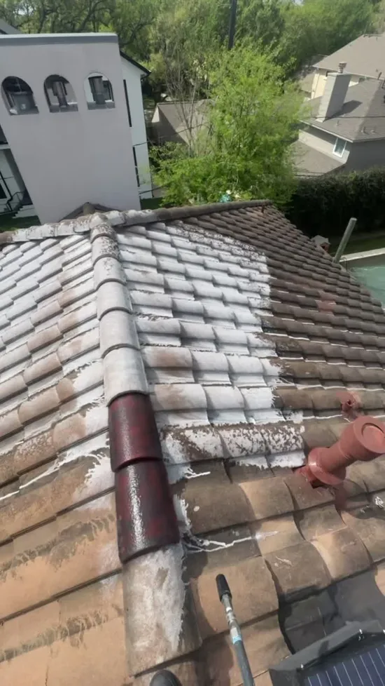 Roof washing soft wash process on a Houston tile roof