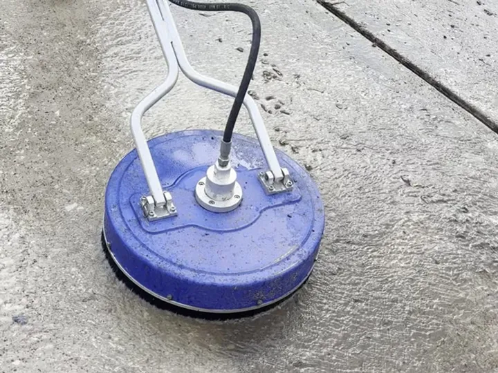 Rotary surface cleaner washing a residential driveway