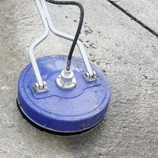 Rotary surface cleaner washing a residential driveway